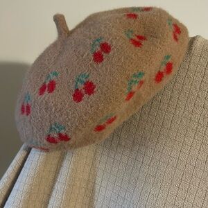 Anthropology Maeve Cherry Beret hat beige. Adjustable string to help fit